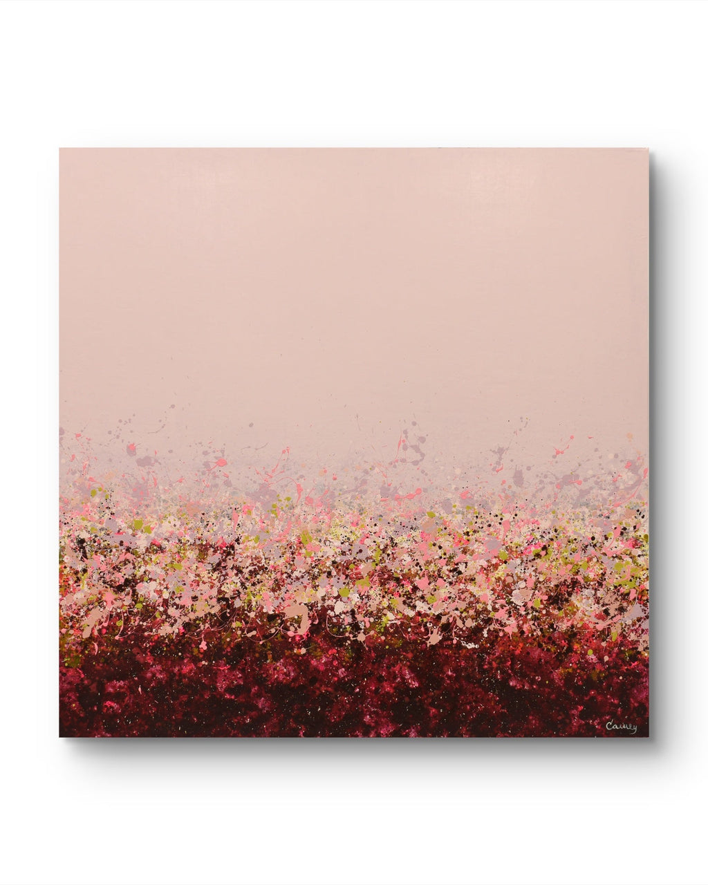 An abstract canvas painting featuring a soft dusty pink sky-like upper section and a dense, textured field of pink, red, burgundy, and small yellow-green accents along the bottom, shown against a clean white background with a subtle drop shadow.